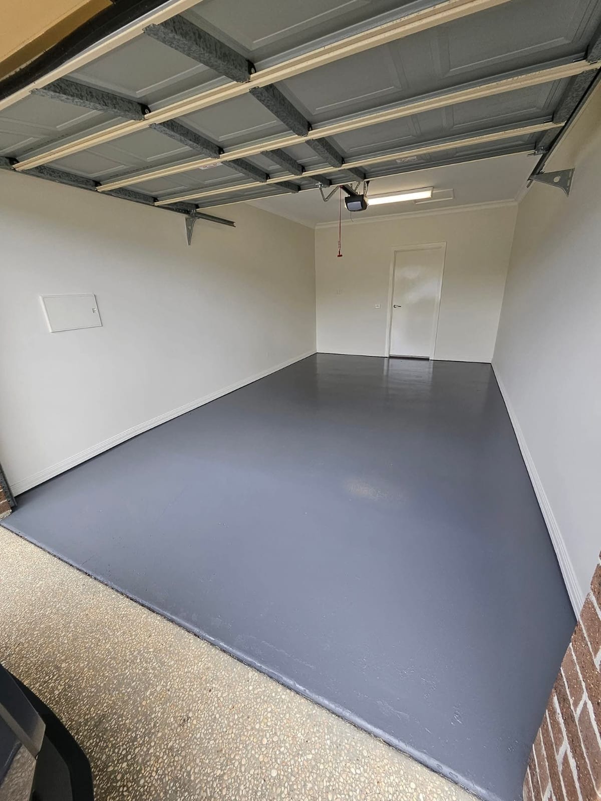 Commercial painting of garage interior with epoxy floor coating